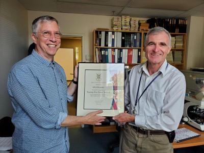 Dr.  John Rossiter - Queens 25 years!